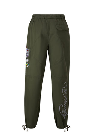 Pantaloni tecnici in tessuto intrecciato con teschio e serpente laterale - Verde
