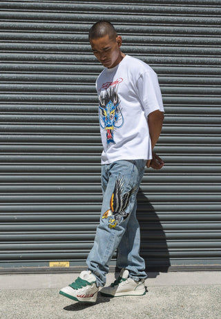 Jeans da uomo con grafica in denim con tatuaggio dell'aquila reale - Candeggina